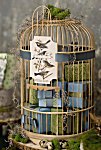 Decorative Birdcage holds gifts and card reads Thank You