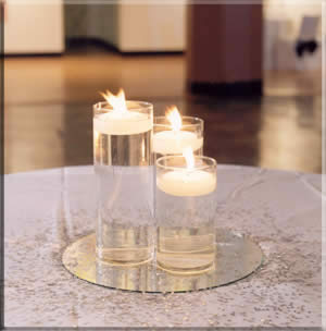 Round Mirror under Glass Cylinders with Floating Candles