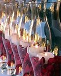 Glass Hurricanes with Pillar Candles and rose petals